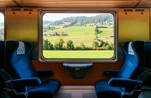 Rural Farmland Through Train Window, Train Travel Concept.