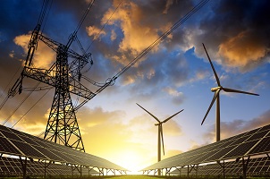 Solar Panels With Wind Turbines And Electricity Pylon At Sunset. Clean Energy Concept.