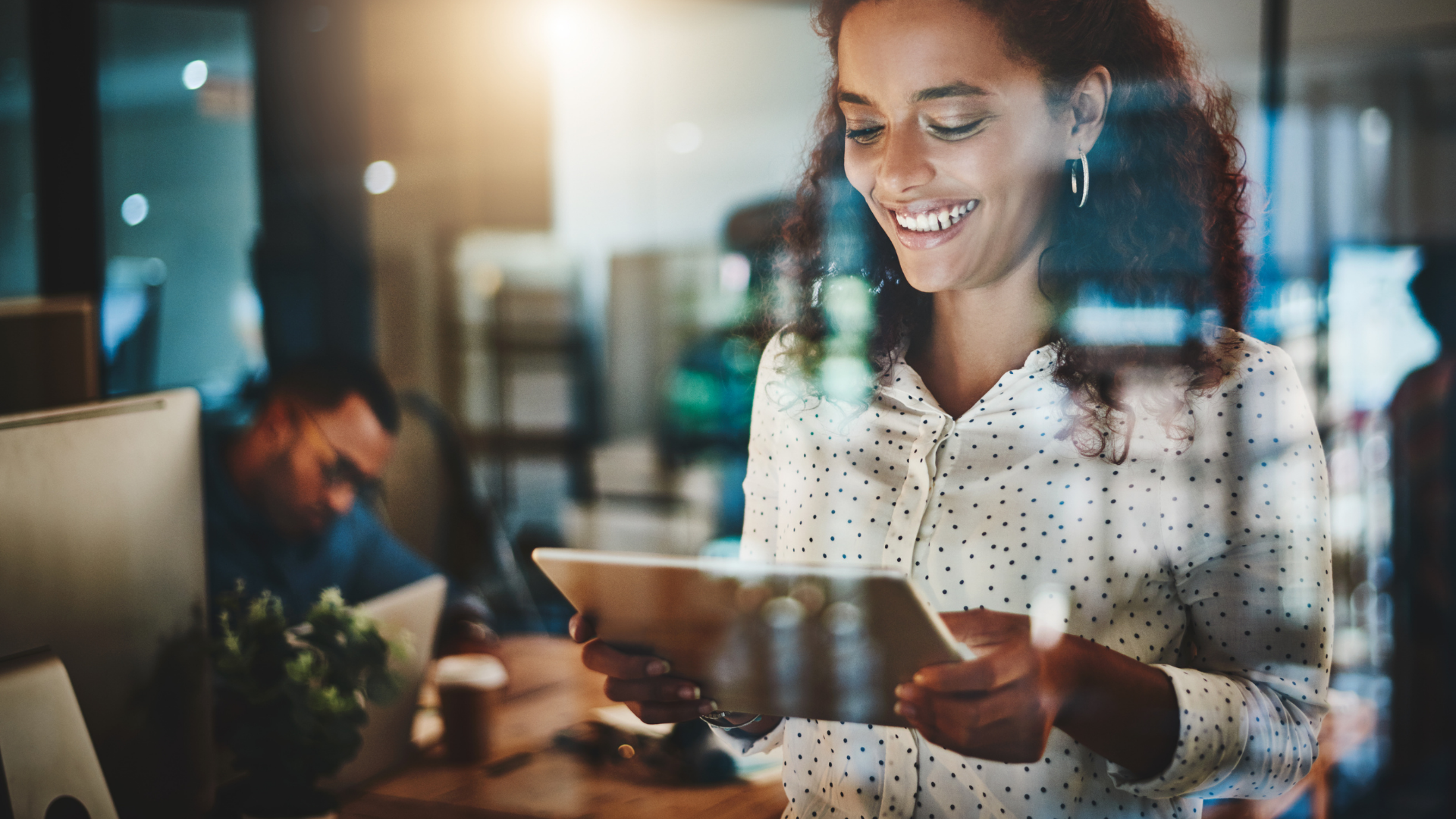 Young business woman looking at the tablet