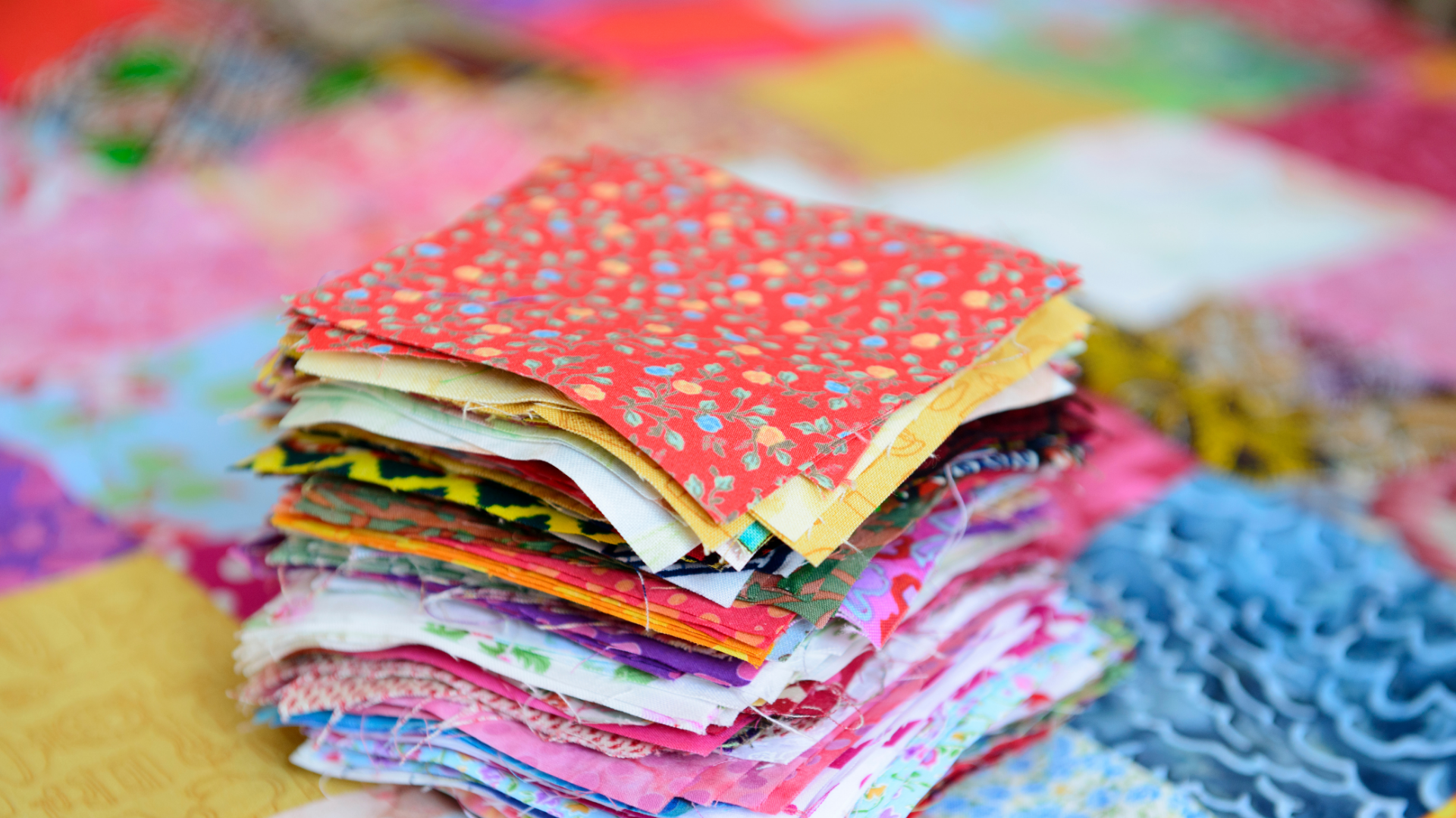 Pile of different colour material for patchwork.