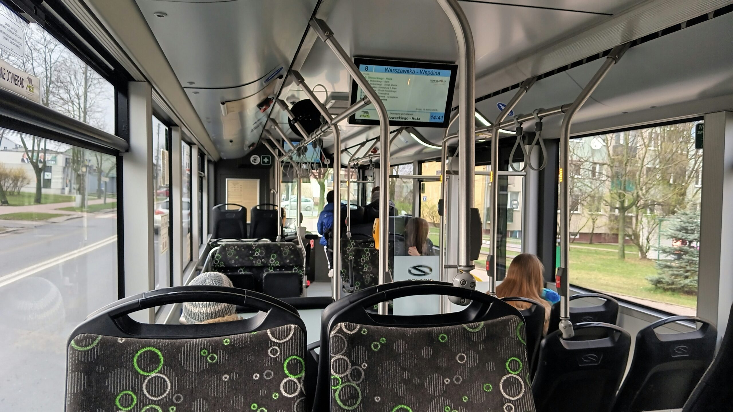 the-interior-of-a-public-transit-bus-with-passengers