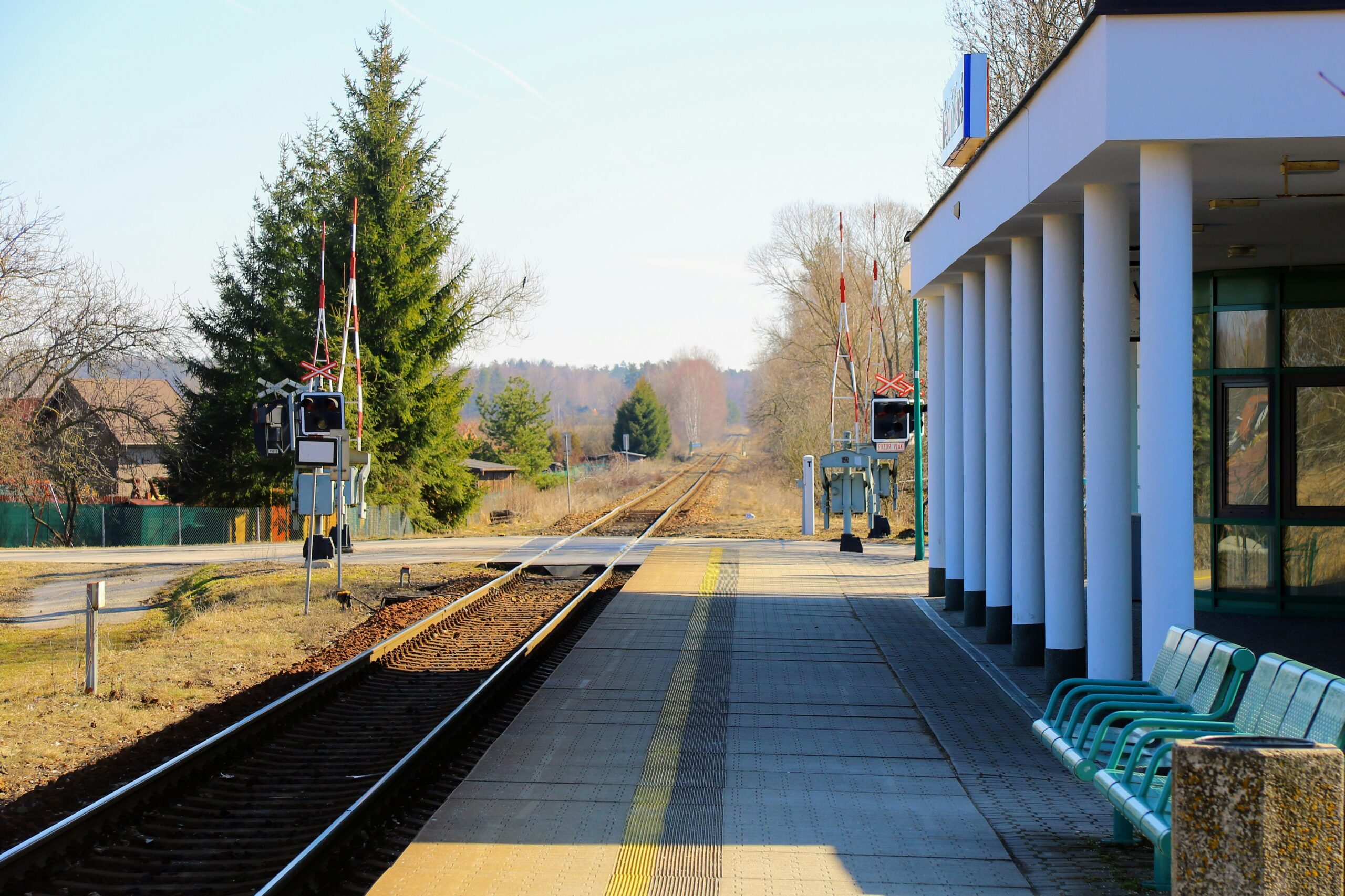 a-bench-sitting-on-the-side-of-a-train-track