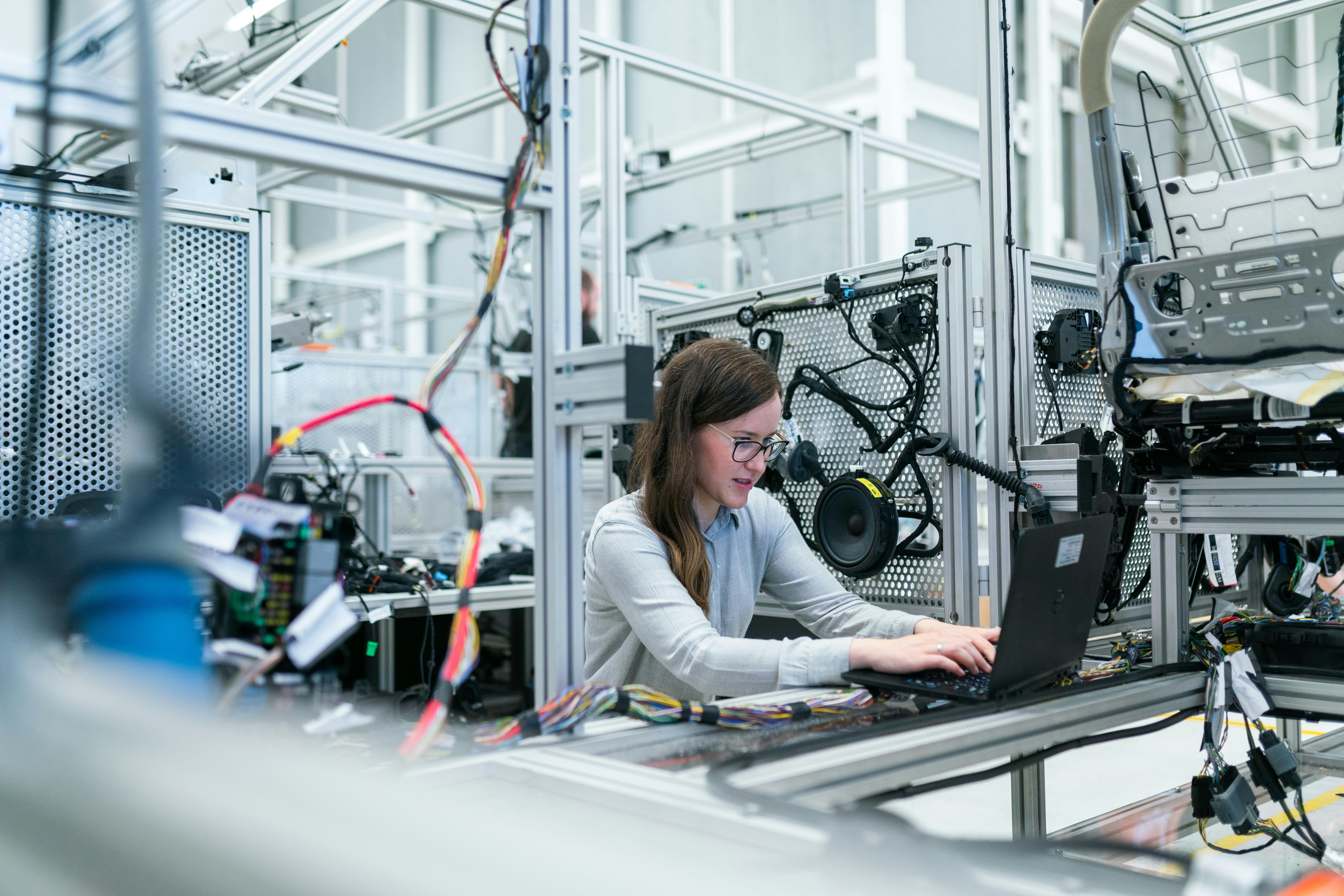 photo-of-female-engineer-working-on-her-workspace